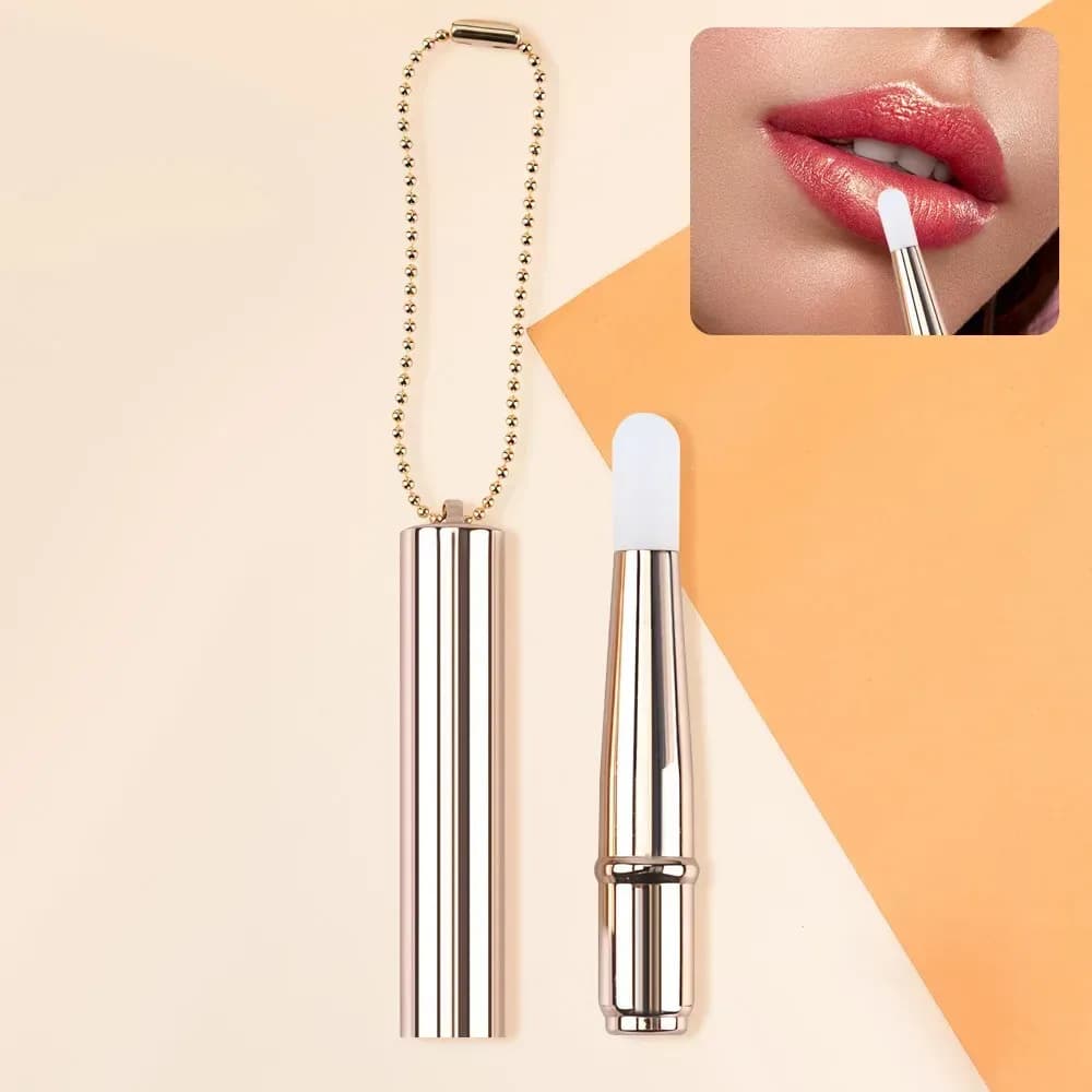gold mini silicone lip brush with chain and applied lip gloss