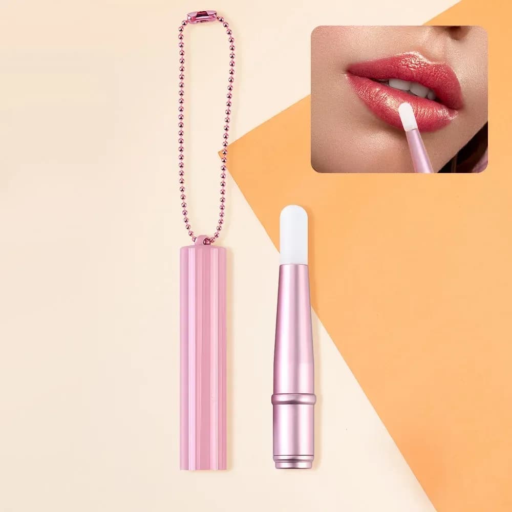 pink mini silicone lip brush with chain and applied lip gloss