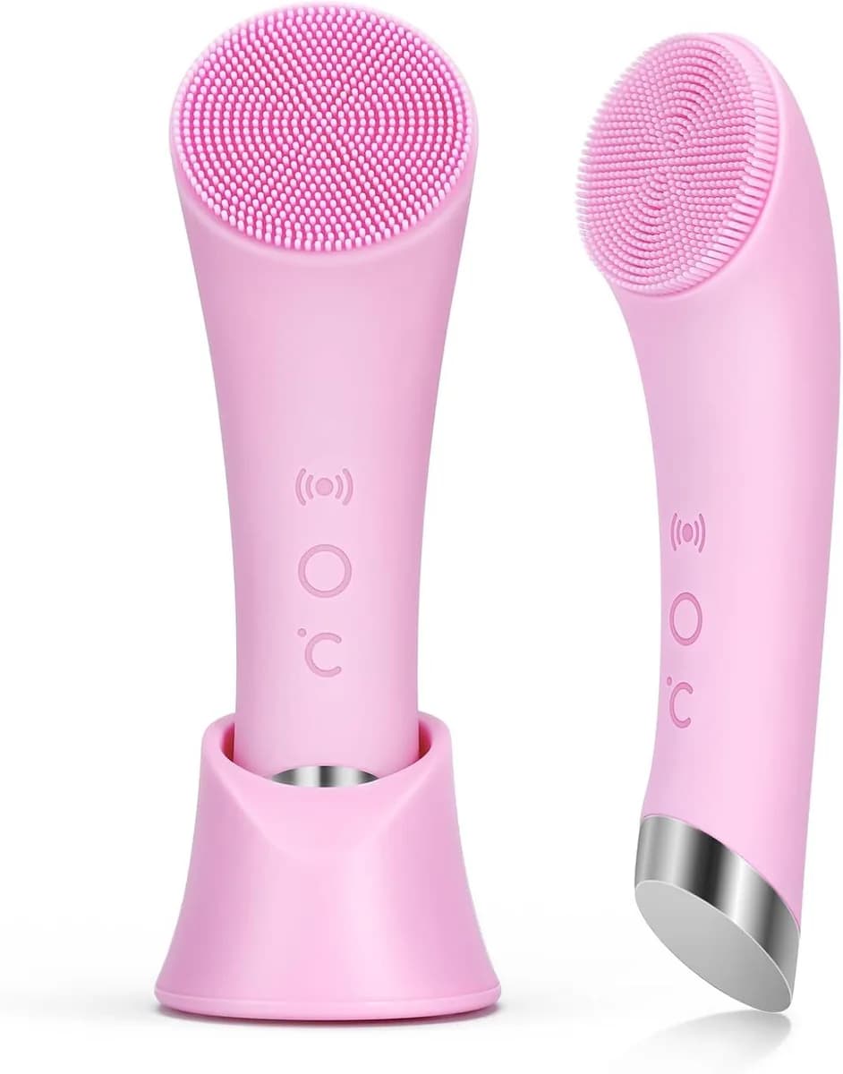 pink heated facial cleansing brush with soft silicone head on its stand